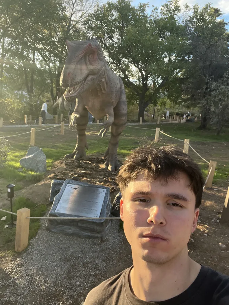 Asan Aliov with a dinosaur